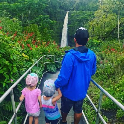 Steve Haumschild hiking to a waterfall with his children