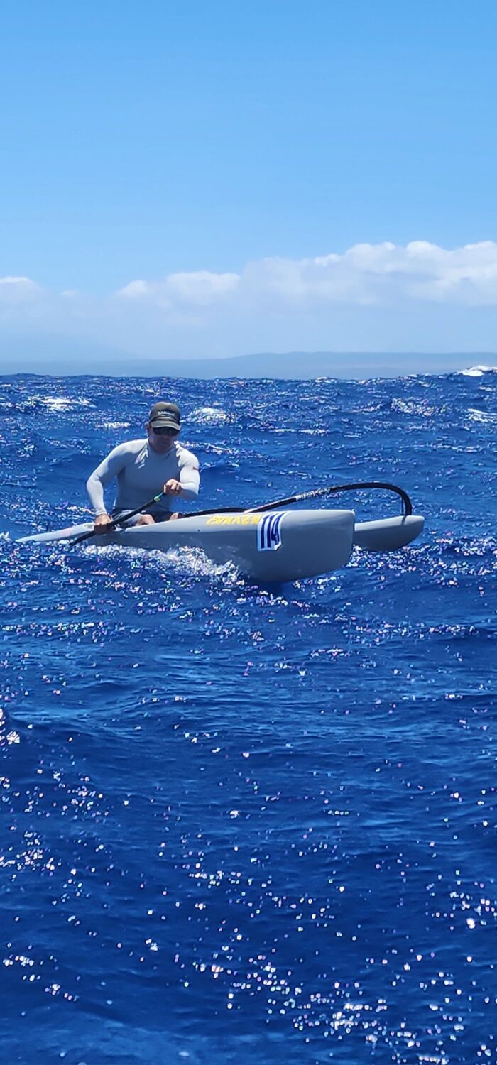 Steve Haumschild stand-up paddleboarding off Oʻahu at sunrise